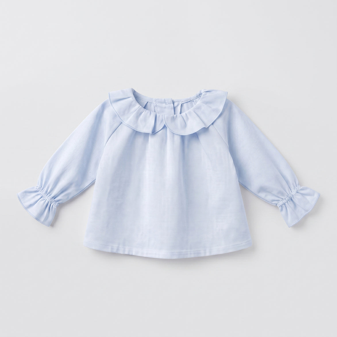 Blusa bebé celeste volante