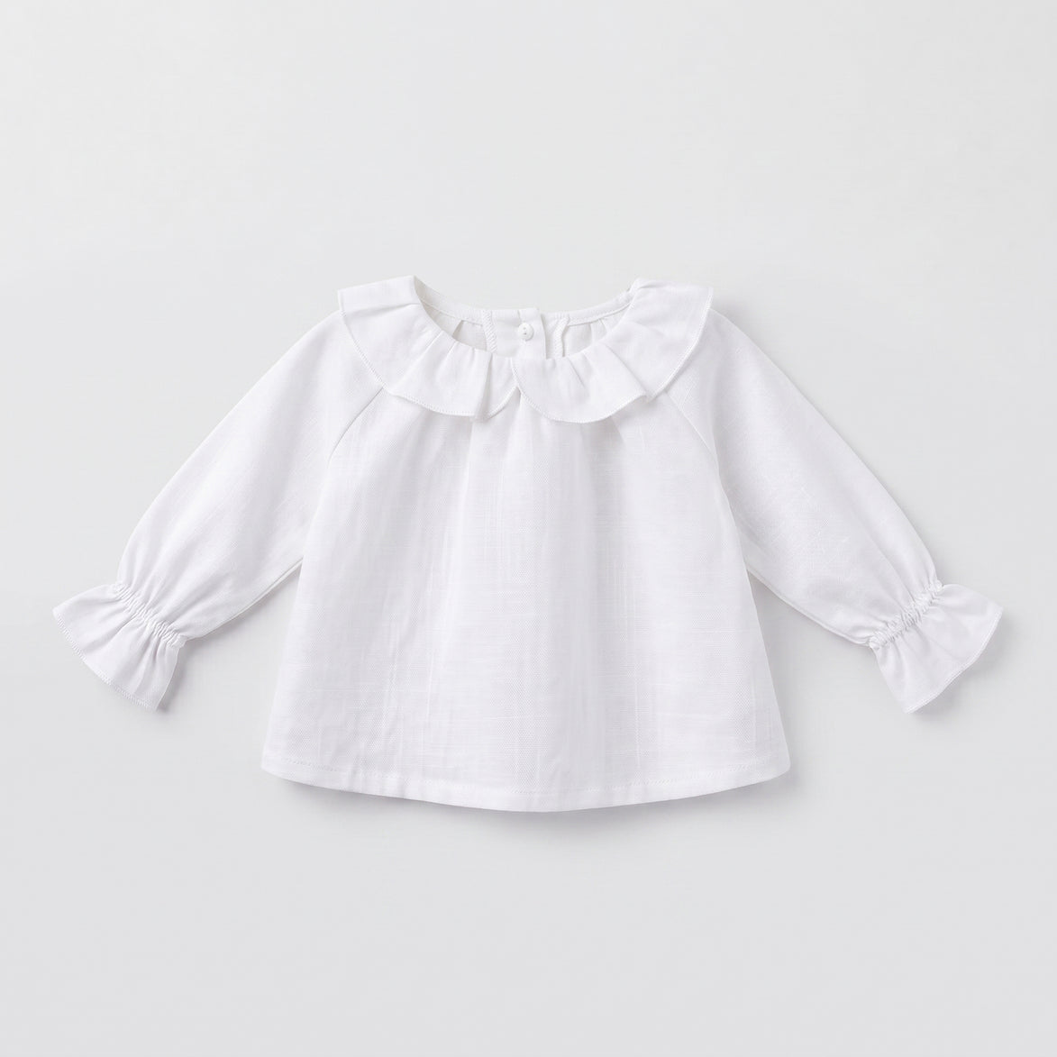 Blusa bebé blanca volante