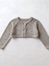 Chaqueta perlé corta beige