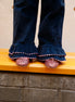Pantalón doble volante pana azul zigzag rosa