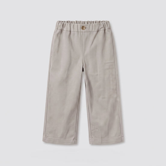 Pantalón beige bolsillos bordados