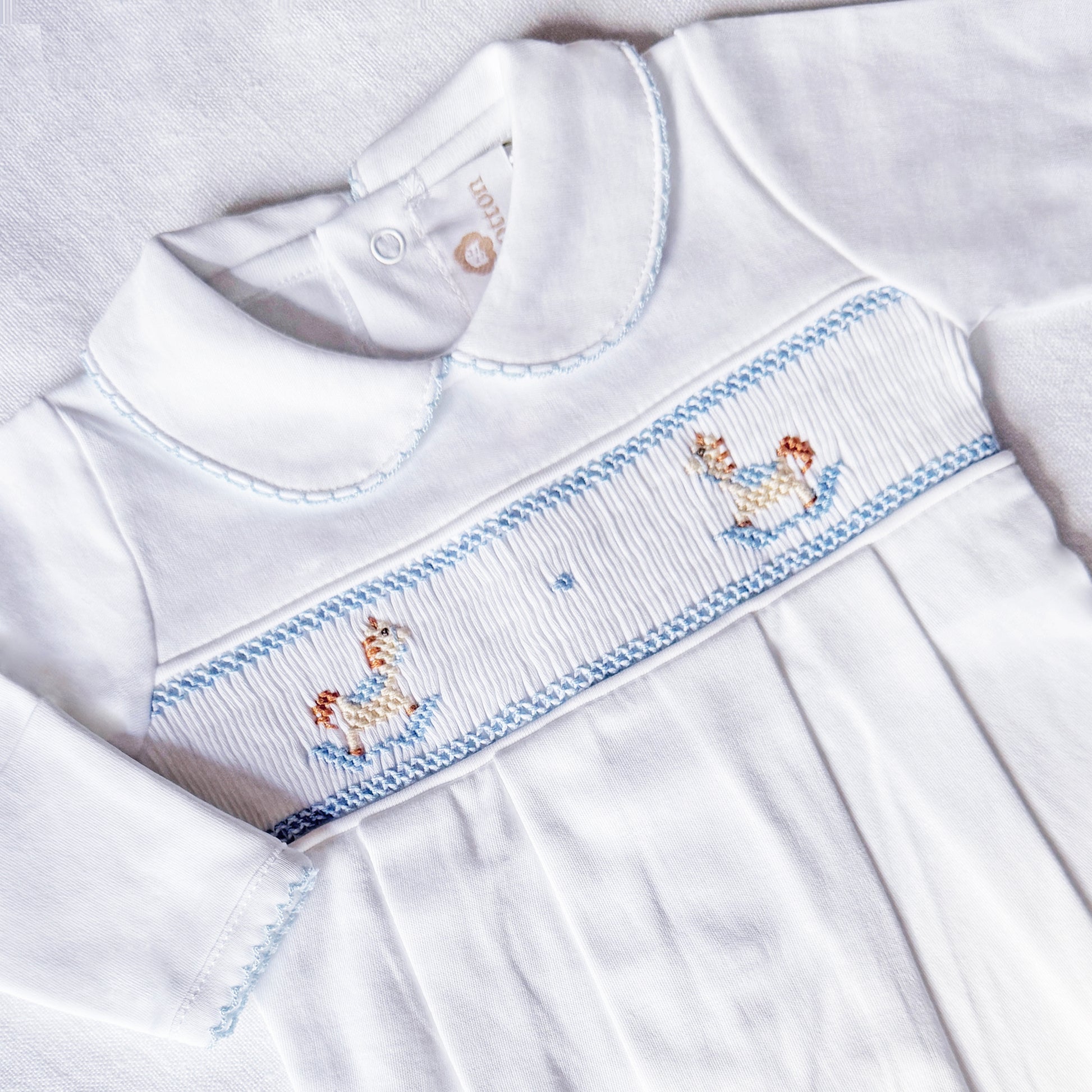 Pijama enterizo ponis blanco